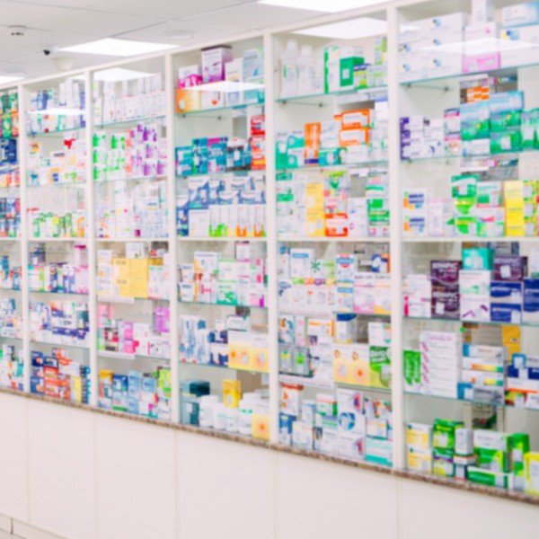 A pharmacy with shelves full of medicine
